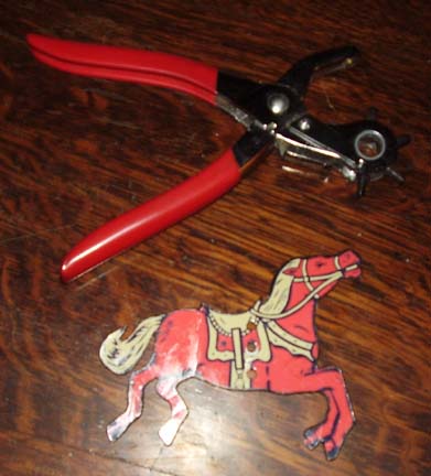 Punch holes in Erector Set horse cutouts