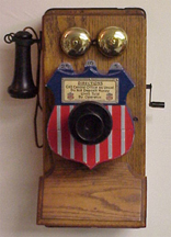 Independent (shield) payphone collector on a Stromberg Carlson Phone