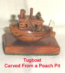 Tugboat carved from a peach pit - Ricks Grandfather