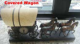 United Metal Goods Covered Wagon Clock
